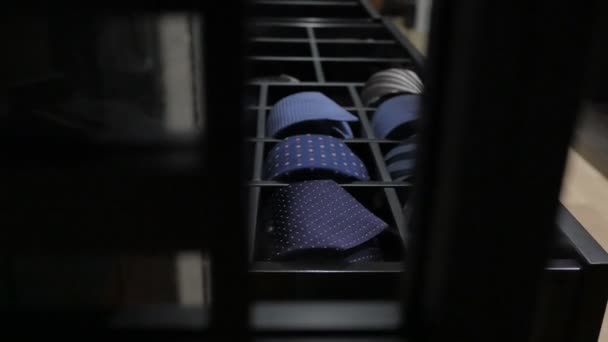 Ties in wardrobe. Mens Clothing lying in the locker room. — Stock Video