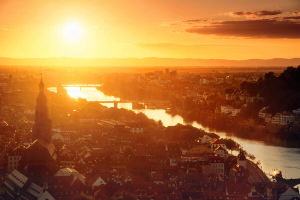 Heidelberg, Germany, romantic aerial view in gold light before sunset, with the old town and the Neckar river