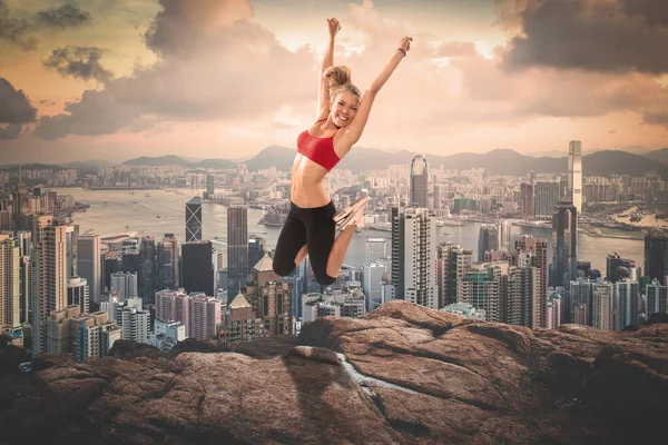 Blonde Beauty Fitness Girl Jumping Tall Rock Front Modern City — Stock Photo, Image