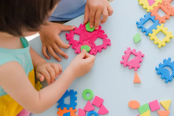 Little girl playing with puzzle, early education — Stock Photo, Image