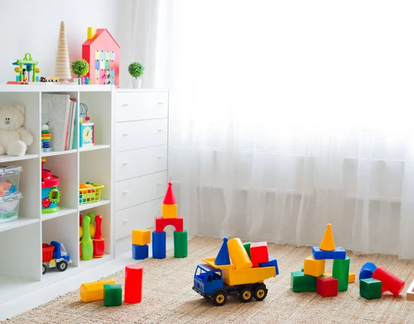 Children's playroom with plastic colorful educational blocks toys. — Stock Photo, Image