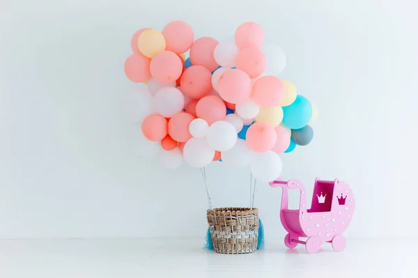 Festive balloons with basket on white background. Congratulations on the newborn.