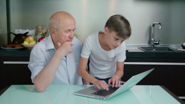 Grandson Teaching Grandfather Using Kitchen — Stock Video