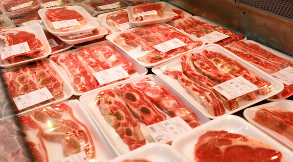 Showcase meat raw products in a supermarket