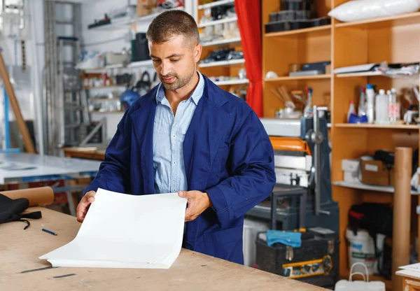 portrait of a working man at printer studio