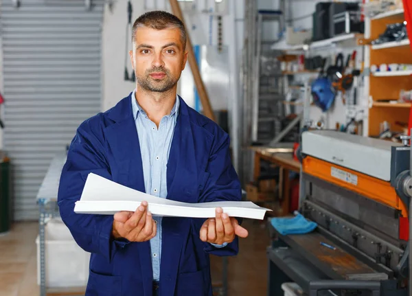 Profession,job,people,workman in special clothes with paper — Stock Photo, Image