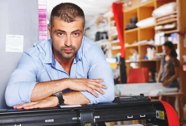 portrait working man at printer studio