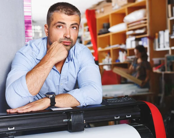 portrait working man at printer studio