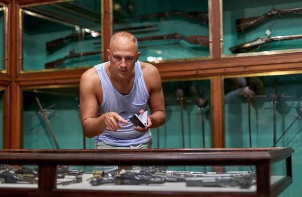 Man visitor in historical museum looking at art object. — Stock Photo, Image
