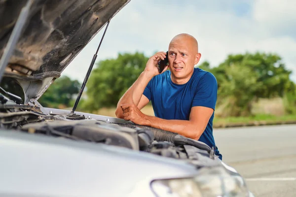 Driver man in front of automobile car accident in road. — Stock Photo, Image