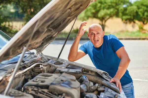 Upset driver man in front of car collision accident in road. — Stock Photo, Image
