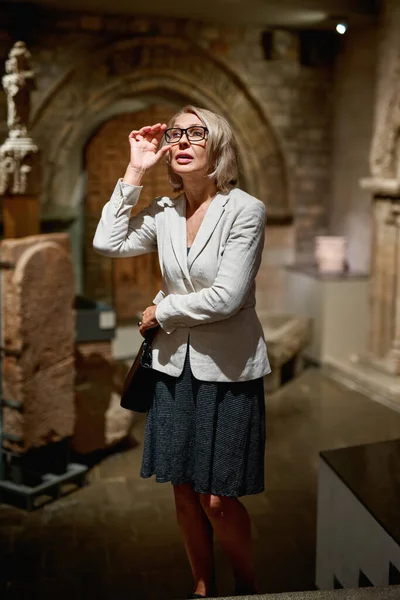 Portrait of a woman visiting museum or art gallery