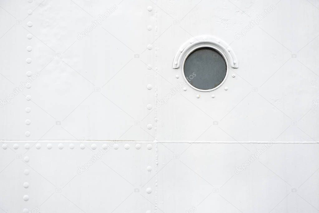 A background with one brass porthole