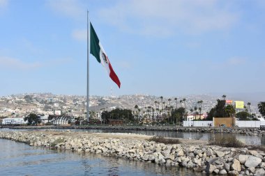 Mexican flag hoisted at the Port of Ensenada in Mexico clipart