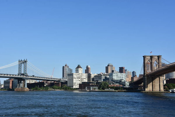 NEW YORK, NY - AUG 1: Brooklyn Bridge and Manhattan Bridge in New York, as seen on Aug 1, 2021.