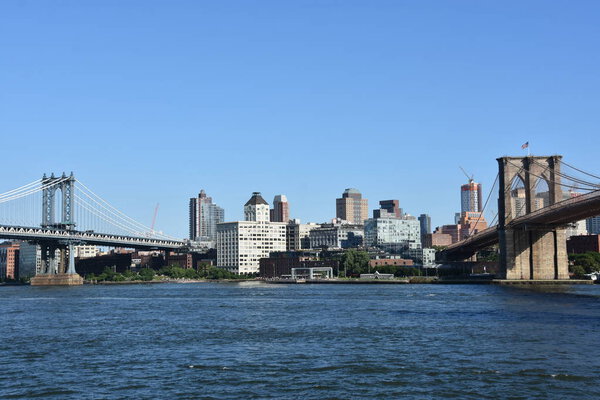 NEW YORK, NY - AUG 1: Brooklyn Bridge and Manhattan Bridge in New York, as seen on Aug 1, 2021.