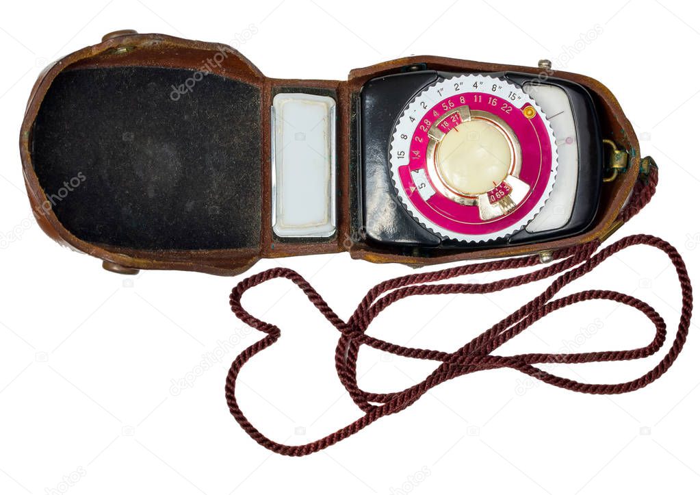 Vintage photo light meter isolated over white background