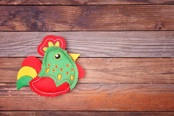 Cock on wooden background — Stock fotografie