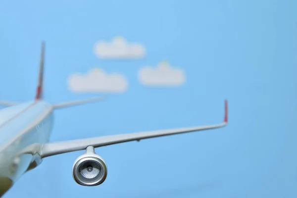 White airplane on a blue — Stock Photo, Image