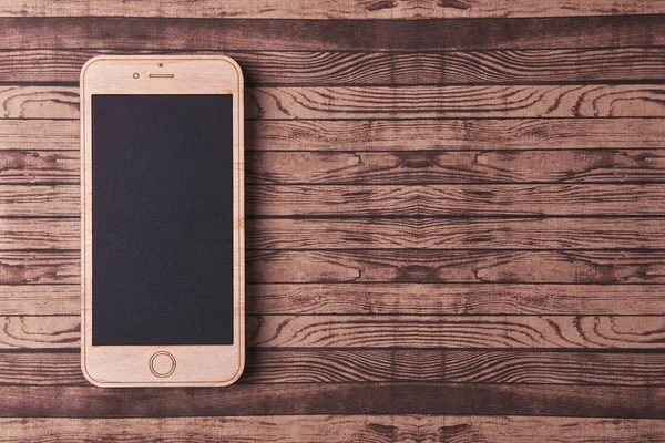 Houten smartphone op een houten — Stockfoto