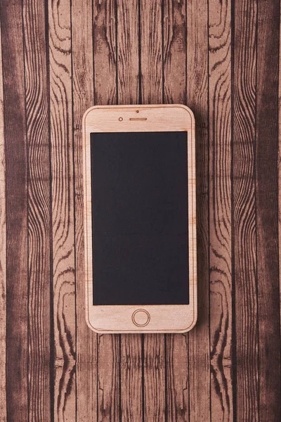 Smartphone de madera en madera —  Fotos de Stock