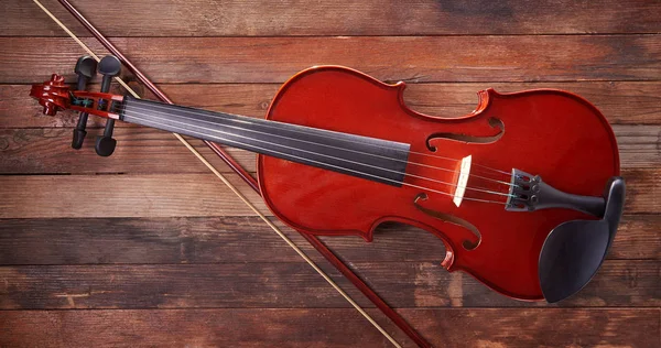 Violin  on a wooden background — Stock Photo, Image