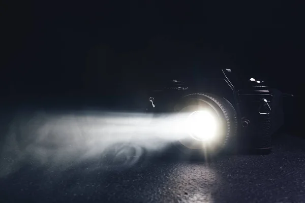 Old camera on a black background — Stock Photo, Image