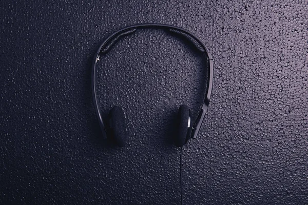 Headphones on a black — Stock Photo, Image