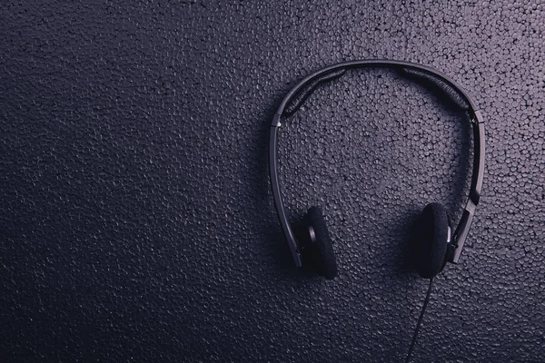 Headphones on a black — Stock Photo, Image