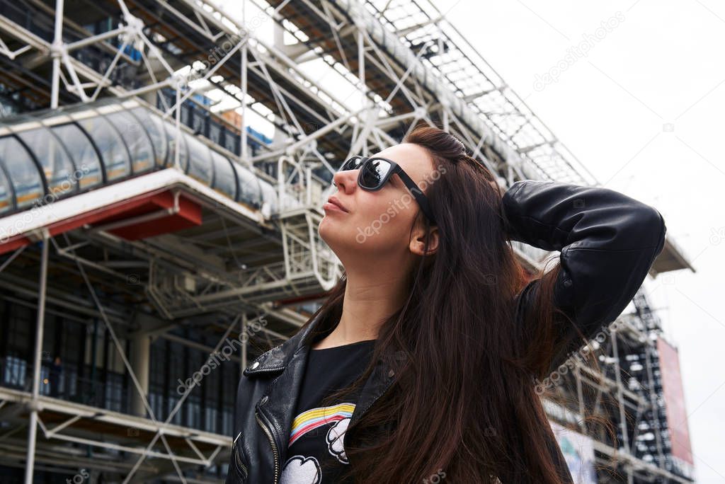 A girl  in front of the Pompidou Center 