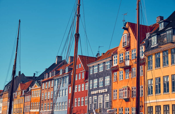 Denmark, Copenhagen - July 2, 2018: Nyhavn is a 17th-century waterfront, canal and entertainment district