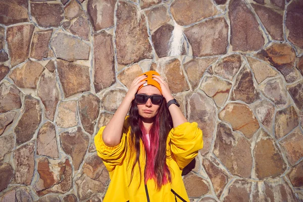 A girl in a yellow jacket — Stock Photo, Image