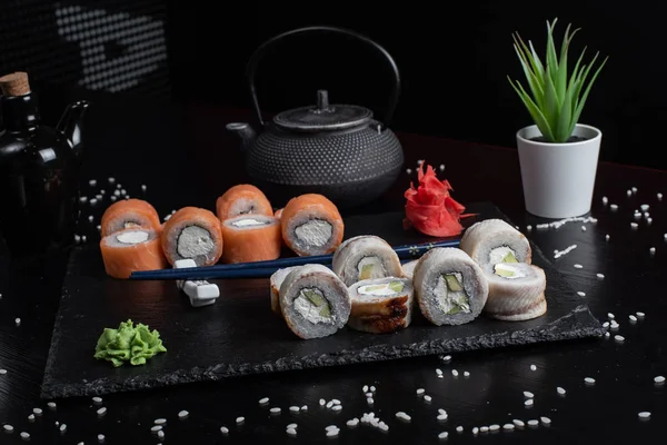 Sushi Set sashimi and sushi rolls served Stock Picture