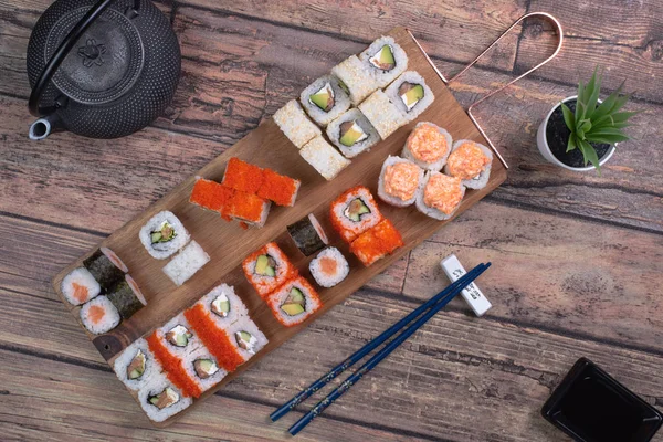 Sushi Set sashimi and sushi rolls served Stock Picture