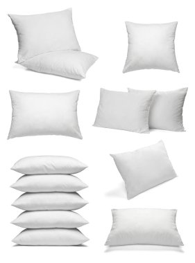 Beyaz arka plan üzerinde çeşitli beyaz yastıklar topluluğu. her biri ayrı ayrı vurulur