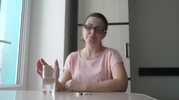 Girl Taking Pills At Home Is Ill Sick Slow Motion Healthcare And Medical Concept Girl Taking Pills At Home Is Ill Sick Slow Motion Healthcare And Medical Concept