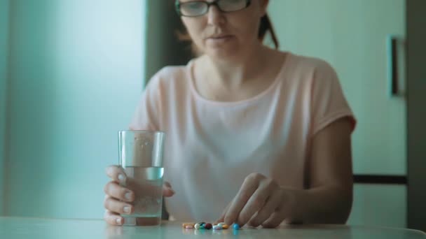 Girl Taking Pills At Home Is Ill Sick Slow Motion Healthcare And Medical Concept Girl Taking Pills At Home Is Ill Sick Slow Motion Healthcare And Medical Concept
