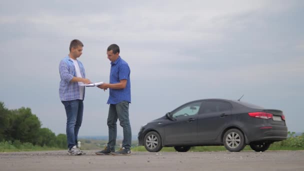two men make deal. man seller driver makes car the auto insurance slow motion video sale sells used cars. Buying rent a car . man car insurance sale of used cars concept lifestyle. man test drive car