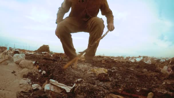 Man homeless dump in a landfill homeless looking for food among the garbage. social concept problem poverty hunger man. lifestyle problem of poverty and social inequality concept — Stock Video