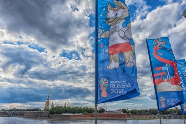 St. Petersburg, RUSSIA - 15,06,2018 The official mascot of the 2018 FIFA World Cup and the FIFA Confederations Cup 2017 wolf Zabivaka on the flags on the Trinity Bridge clipart