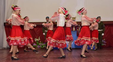 Russia, Pskov. 31,10,2017 Participants of folk dance ensemble in Russian traditional clothing. Festival in honor of National Unity Day in Russia clipart