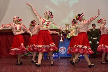 Russia, Pskov. 31,10,2017 Participants of folk dance ensemble in Russian traditional clothing. Festival in honor of National Unity Day in Russia clipart
