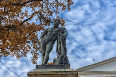 Russia, Tsarskoye Selo, 14,10,2018 bronze sculpture of Hercules of Farnese in front of the palace clipart