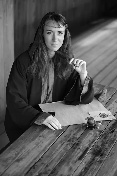 Woman Medieval Cloak Sits Pen Writes — Stock Photo, Image