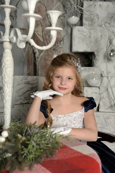 Beautiful Blonde Curls Blue Dress Sitting Table Christmas — Stock Photo, Image