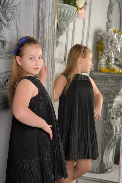 Girl Blonde Child Black Dress Looks Herself Mirror — Stock Photo, Image