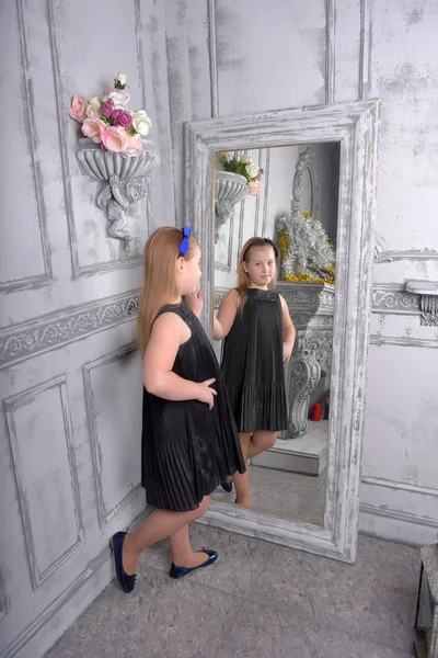Girl Blonde Child Black Dress Looks Herself Mirror — Stock Photo, Image