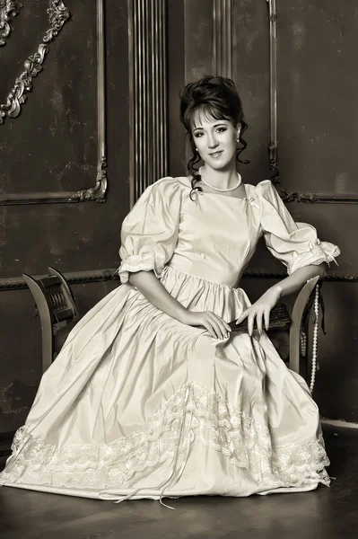 Victorian vintage photo of a woman in the interior, sepia — Stock Photo, Image