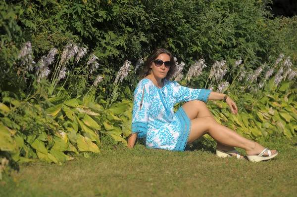 Young Woman Blue Dress Sunglasses Summer Park Flower Garden — Stock Photo, Image