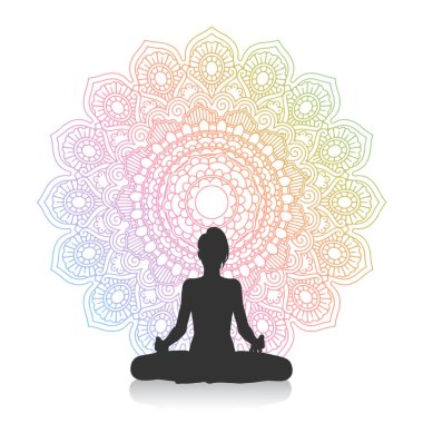 Yogadaki bir kadının silueti mandala tasarımına karşı poz veriyor.